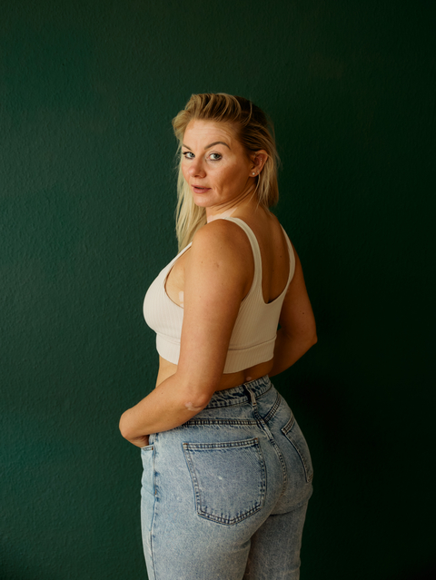 Katie Stu in jeans looking back